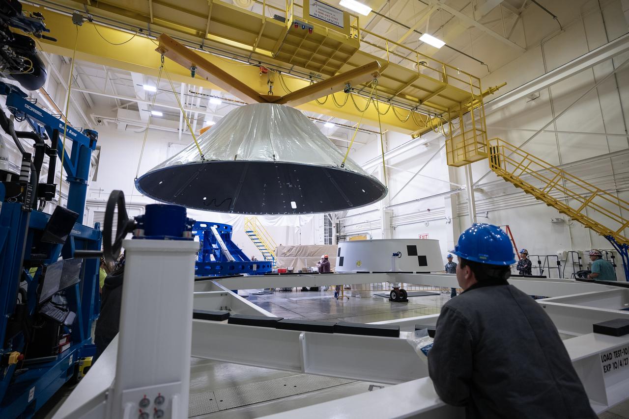 These photos and videos show how NASA manufactured and prepared to transport the payload adapter in February inside Building 4708 at NASA’s Marshall Space Flight Center in Huntsville, Alabama.  Prior to moving the hardware for testing, teams installed the New Explorations Secondary Transport component, called the NEST, into the top of the engineering development unit. The NEST component will allow the hardware to hold a series of secondary payloads, or small satellites. The cone-shaped payload adapter is about 8.5 feet tall and features two metal rings and eight composite panels. The adapter, which will debut on NASA’s Artemis IV mission, is an evolution from the Orion stage adapter used in the Block 1 configuration of the rocket for the first three Artemis missions. It will be housed inside the universal stage adapter atop the rocket’s more powerful in-space stage, called the exploration upper stage. The payload adapter, like the launch vehicle stage adapter and the Orion stage adapter, is fully manufactured and tested at Marshall, which manages the SLS Program.  NASA is working to land the first woman, first person of color, and its first international partner astronaut on the Moon under Artemis. SLS is part of NASA’s backbone for deep space exploration, along with the Orion spacecraft and Gateway in orbit around the Moon and commercial human landing systems, next-generational spacesuits, and rovers on the lunar surface. SLS is the only rocket that can send Orion, astronauts, and supplies to the Moon in a single launch. 